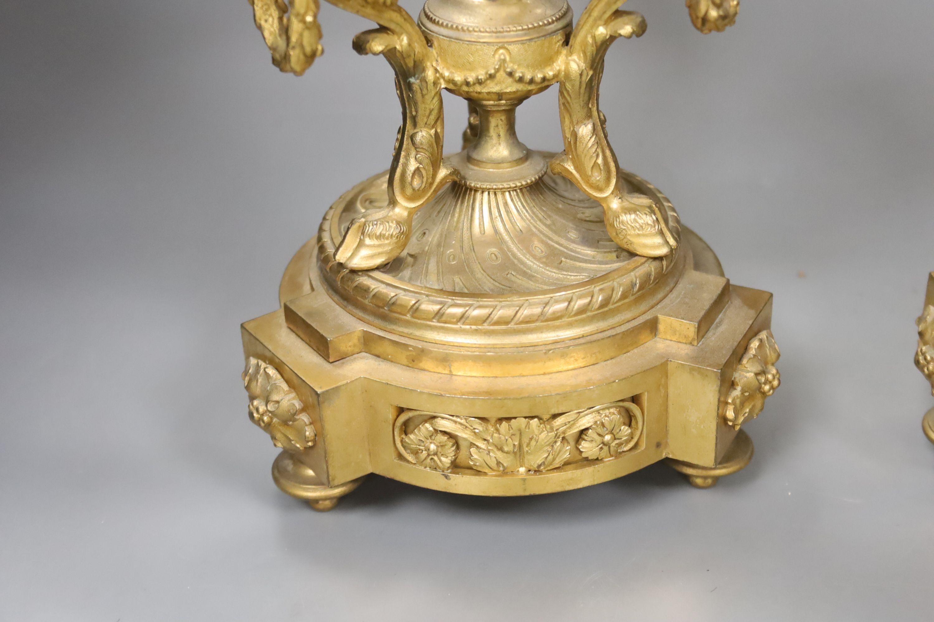 A pair of ormolu three branch candelabra